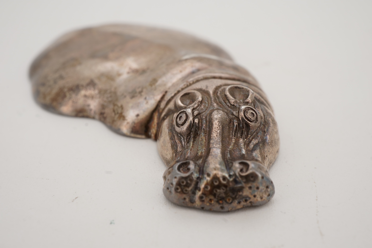 A late 20th century Patrick Mavros white metal novelty paperweight, modelled as a 'submerged' hippopotamus